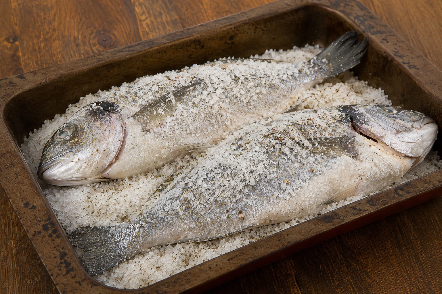 salt food preservation showing traditional fish curing method with sea salt